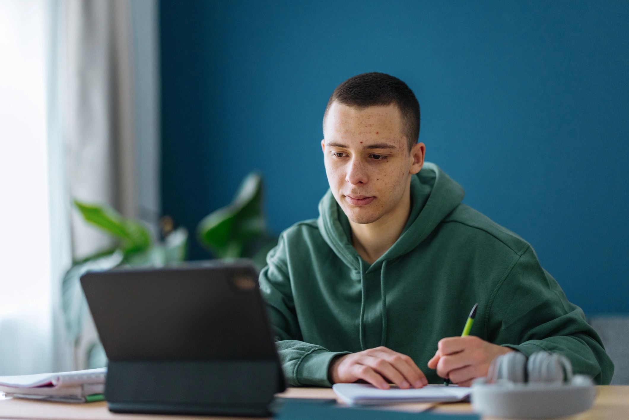Student studying math at home during an online tutoring session