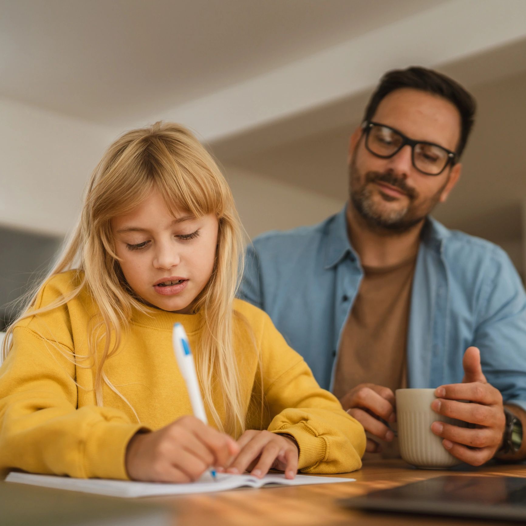 Parent helping a student with homework at home